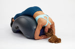 Woman performing lower back stretch with Aerotrainer
